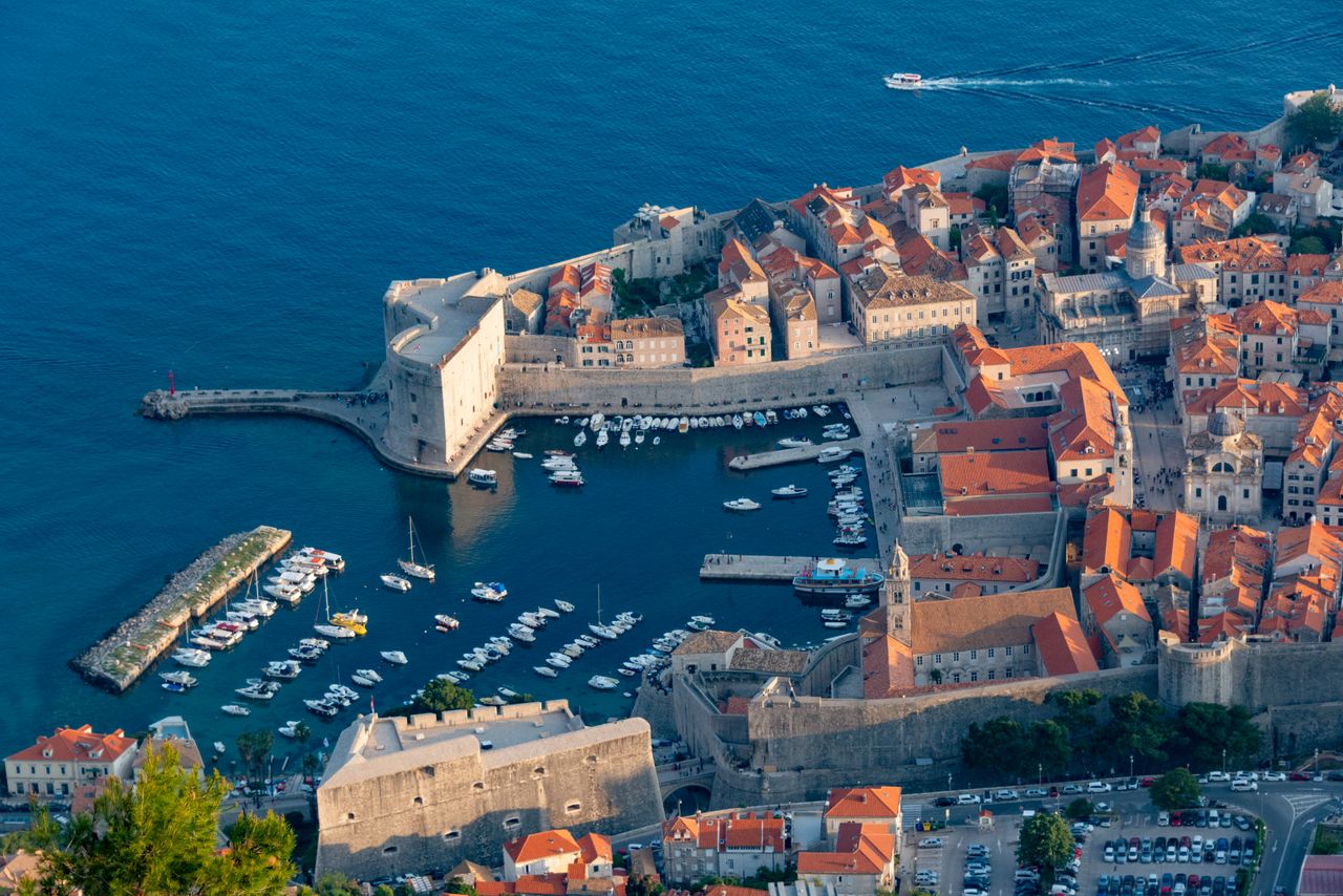 A stunning aerial view of Dubrovnik's old town, showcasing its historic architecture and marina.